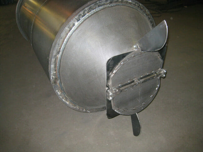 Custom steel tank with perforated metal hopper at base